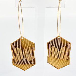 Gold Acrylic Geometric hanging earrings with a large rings.